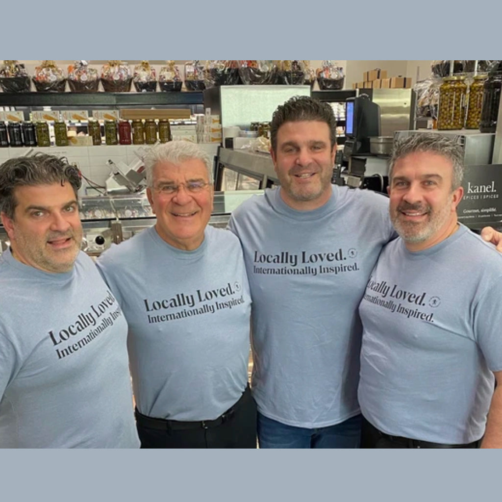 De Luca’s “Locally Loved, Internationally Inspired” T-Shirt